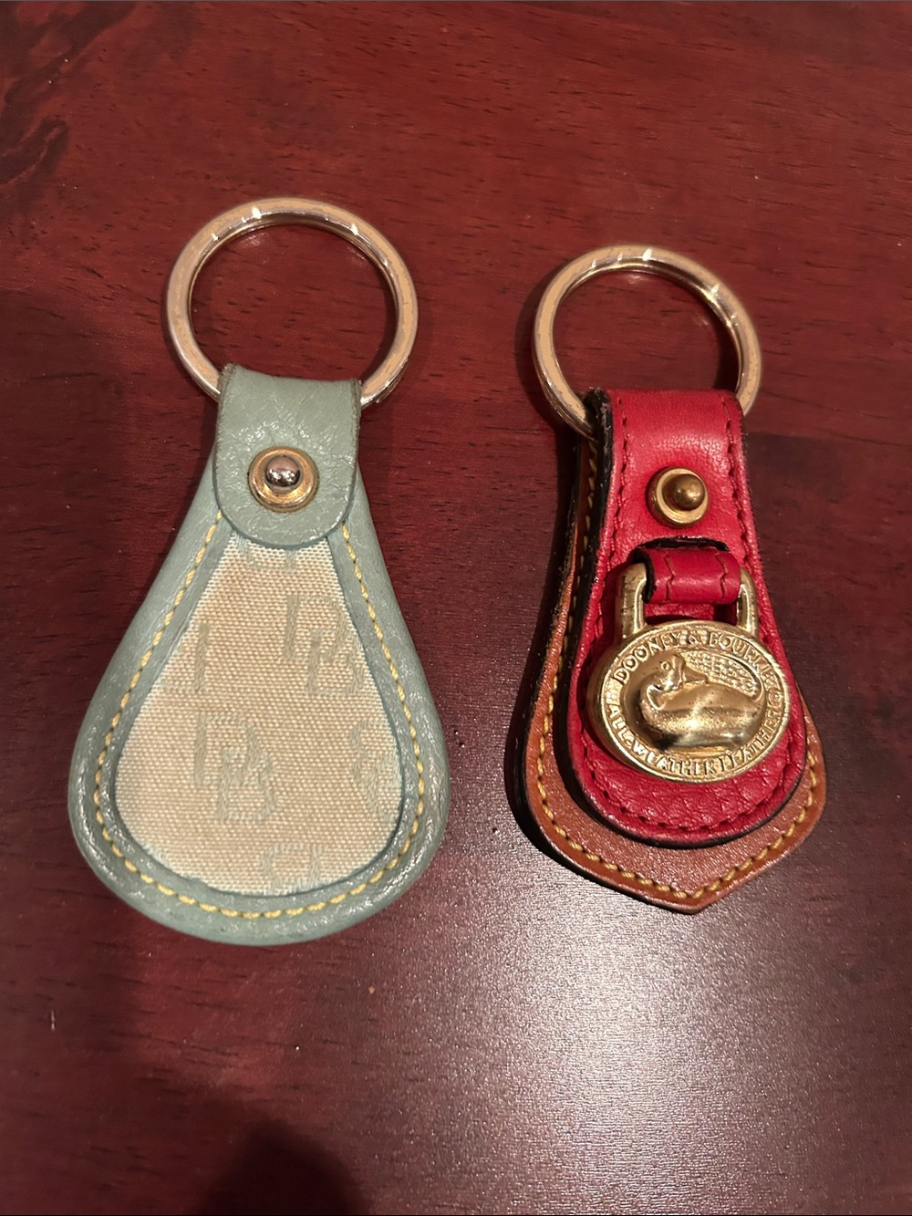 DOONEY & Bourke Red Leather Keychain with Gold Emblem and Teal Leather Keychain